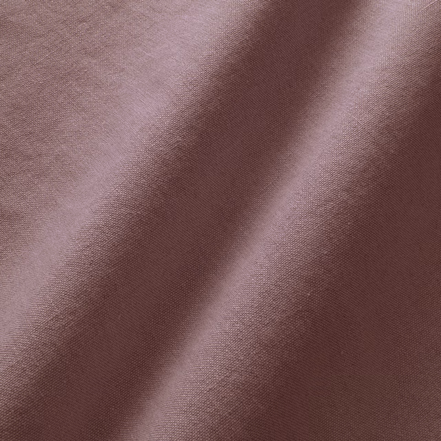 Dusky mauve-rose linen with fine plain weave and lilac fold highlights