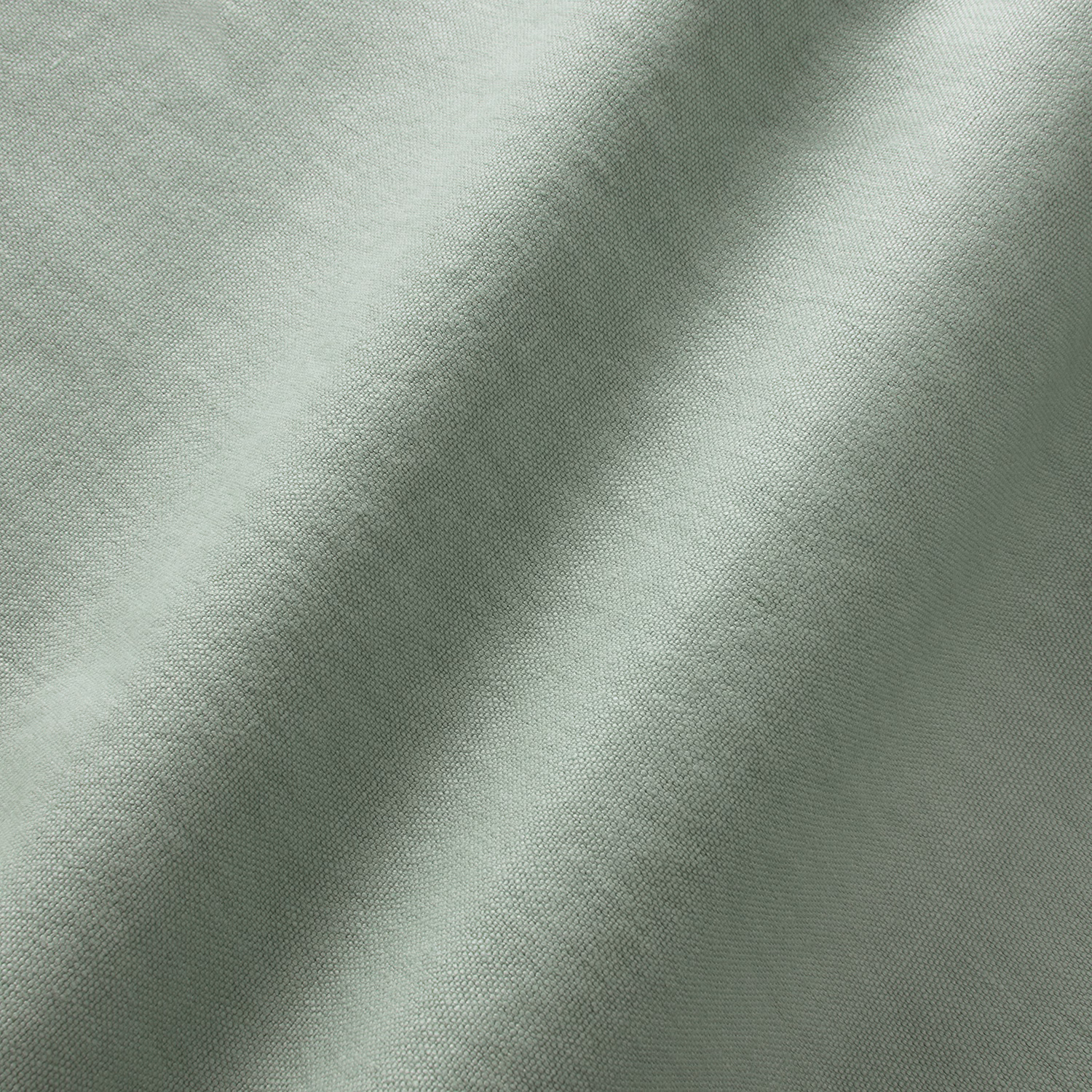 Pale aqua-green linen plain weave with softly shifting texture across draped folds