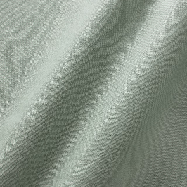 Pale aqua-green linen plain weave with softly shifting texture across draped folds