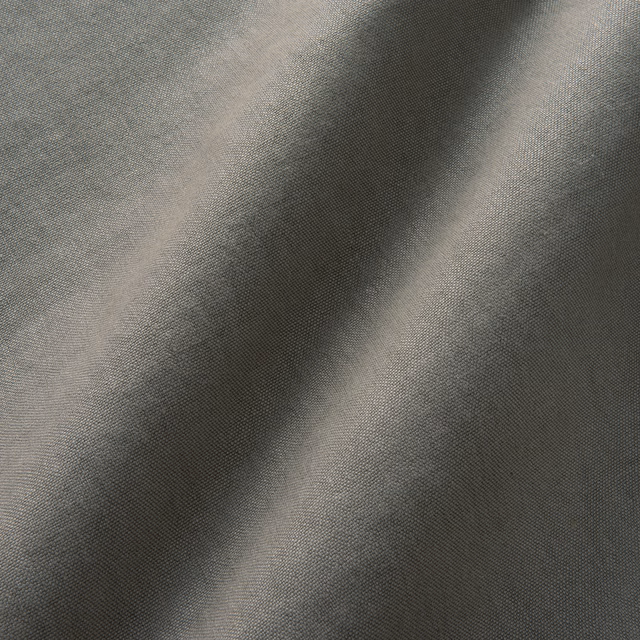 Cool charcoal-grey linen with fine plain weave and deep fold shadows