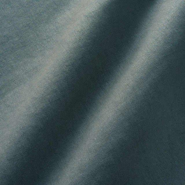 Cool slate blue-grey linen with fine weave and soft diagonal fold highlights