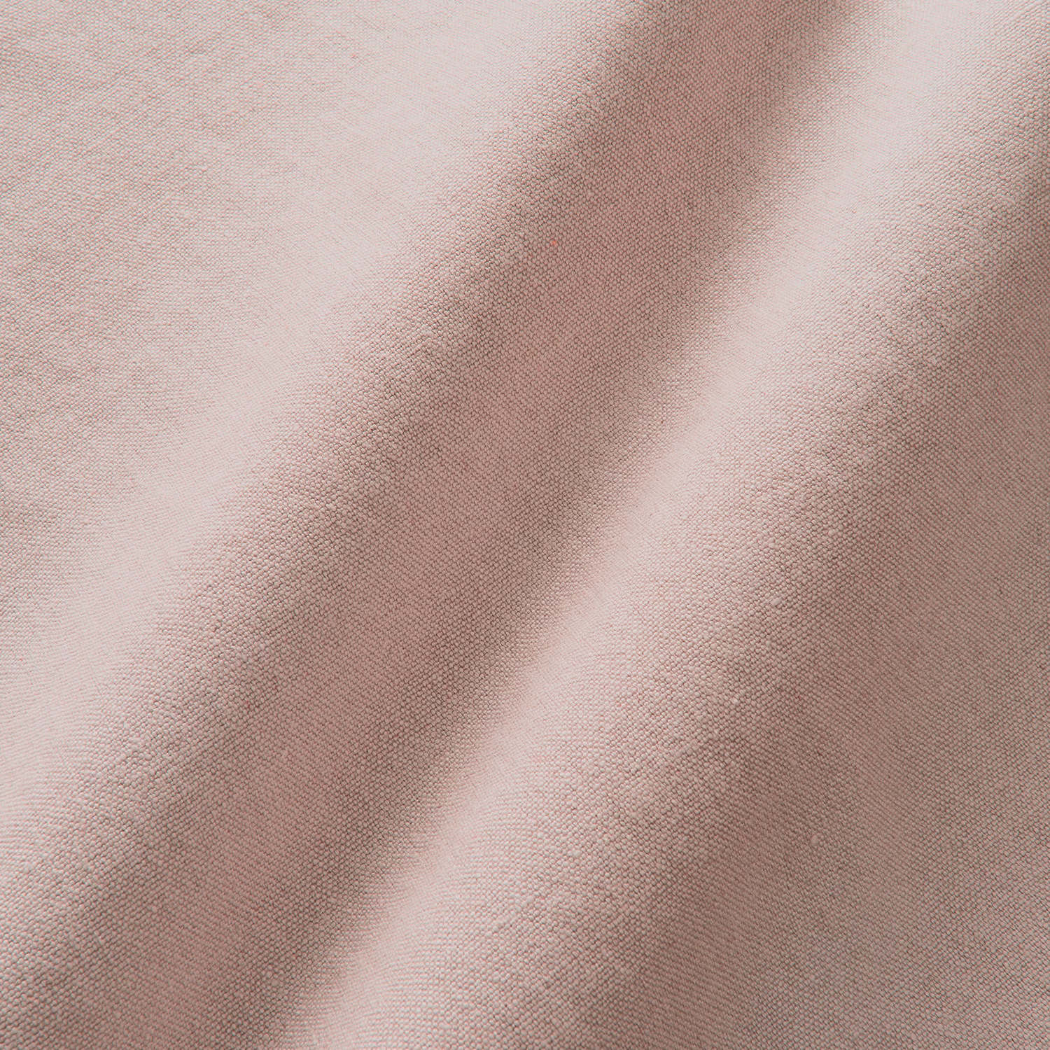 Pale blush pink linen with a fine plain weave and softly shaded folds