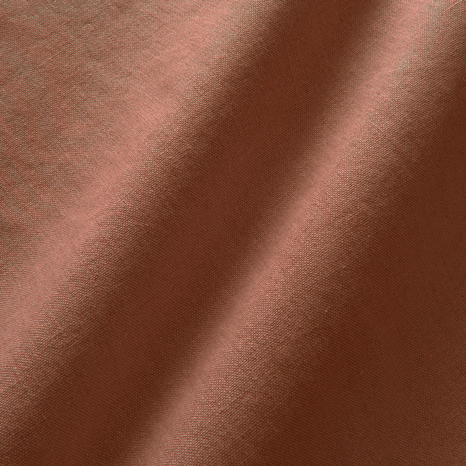 Warm dusky rose linen with fine plain weave and softly shaded folds