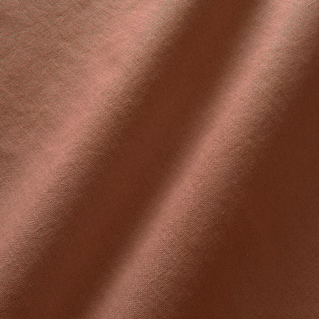 Warm dusky rose linen with fine plain weave and softly shaded folds