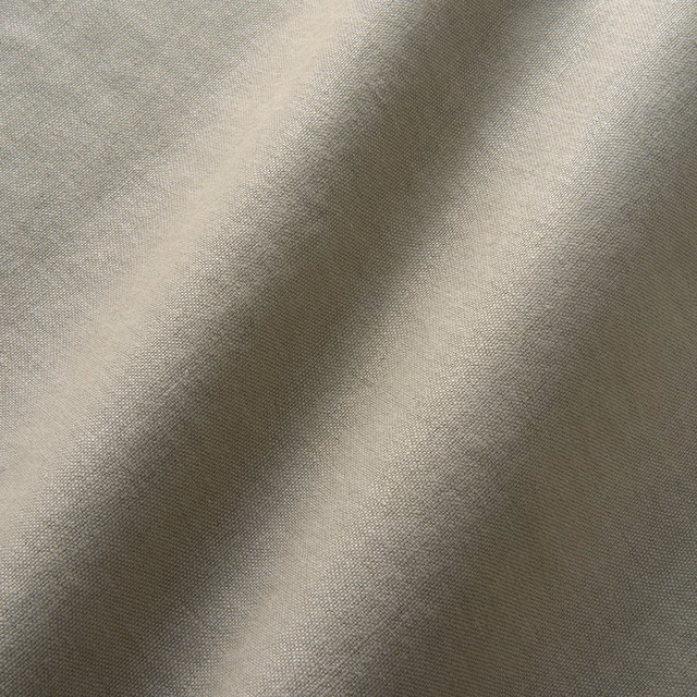 Close-up of soft grey-taupe linen with a fine plain woven texture
