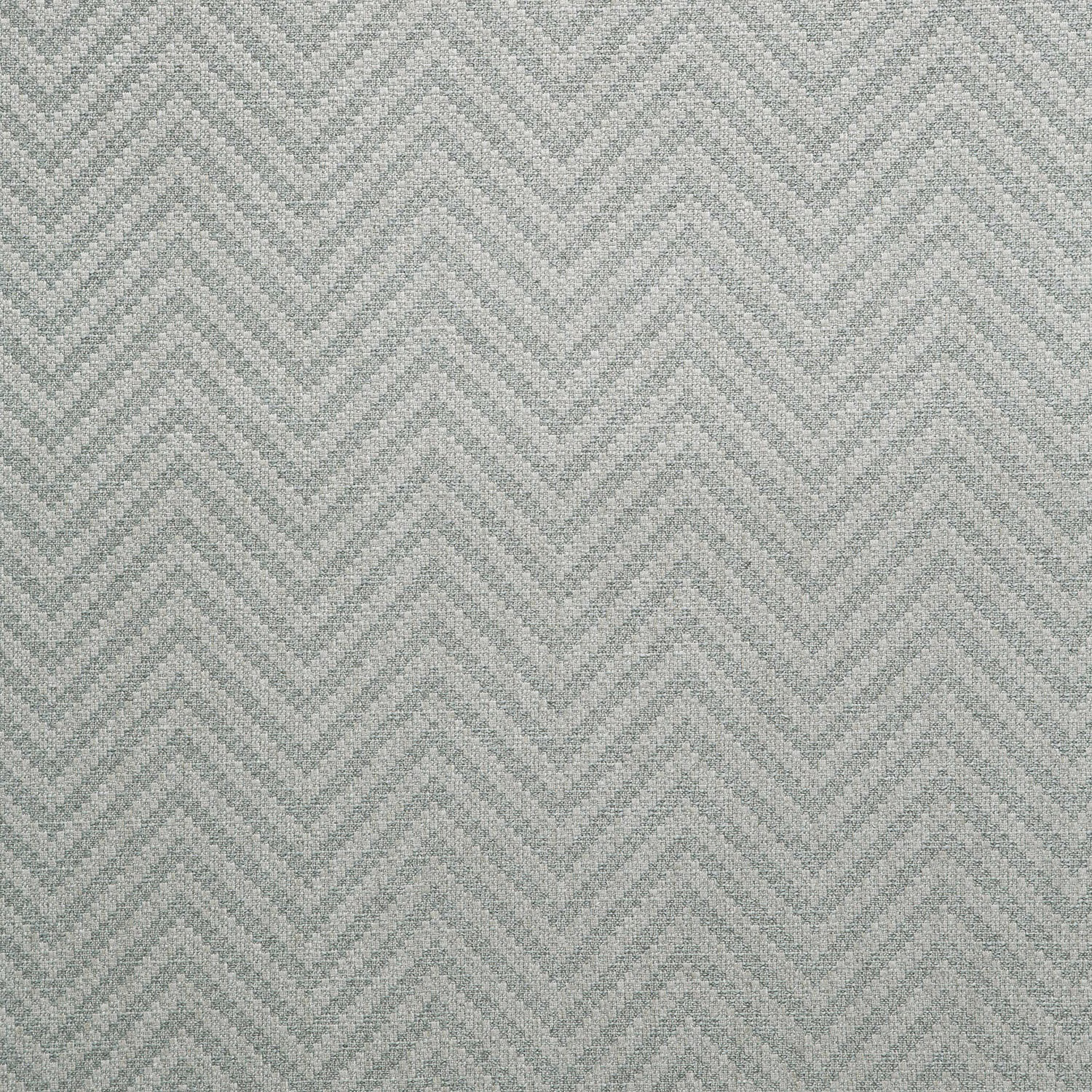 Cool ash-grey woven textile with a softly textured repeating chevron pattern