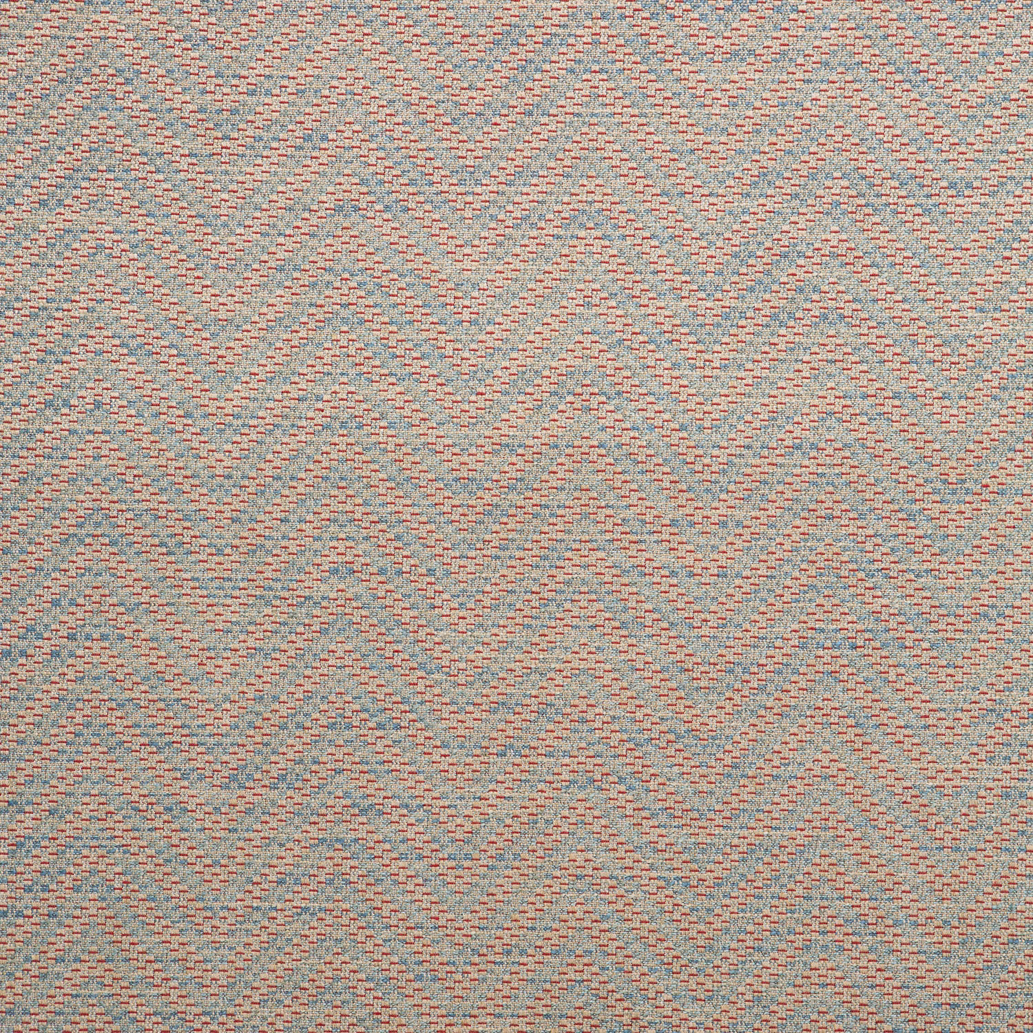 Muted aqua and coral chevrons woven across a warm beige ground