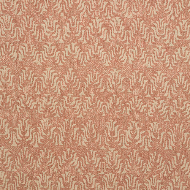 Warm blush woven ground with cream and terracotta maze-like organic motifs