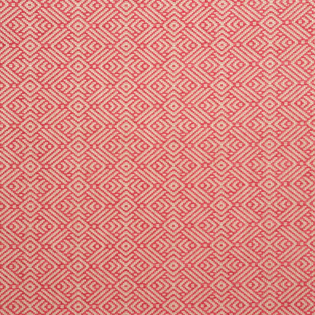 Pink-coral woven fabric with cream diamond and zigzag motifs in close repeat