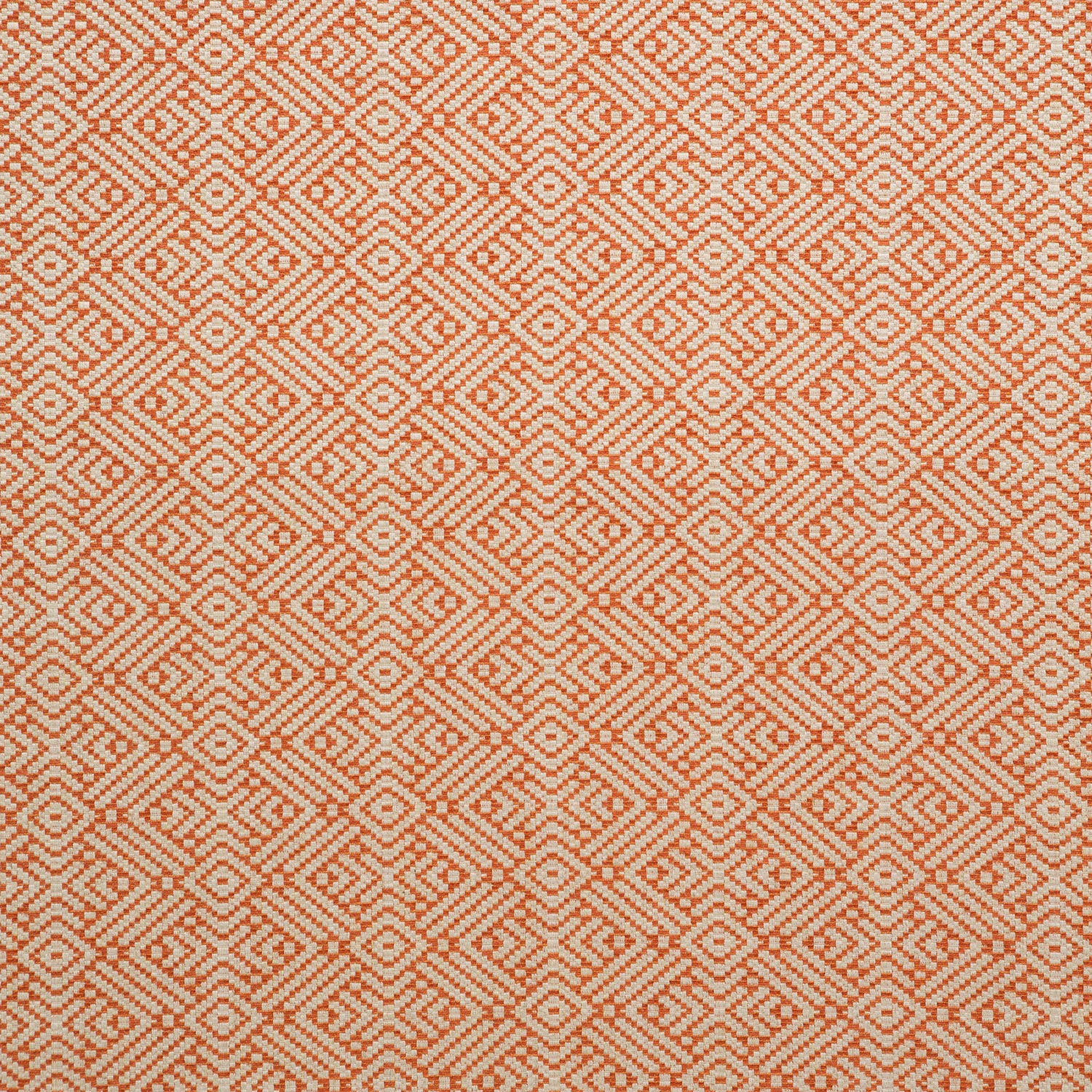 Muted terracotta and cream woven fabric with small stepped diamond motifs