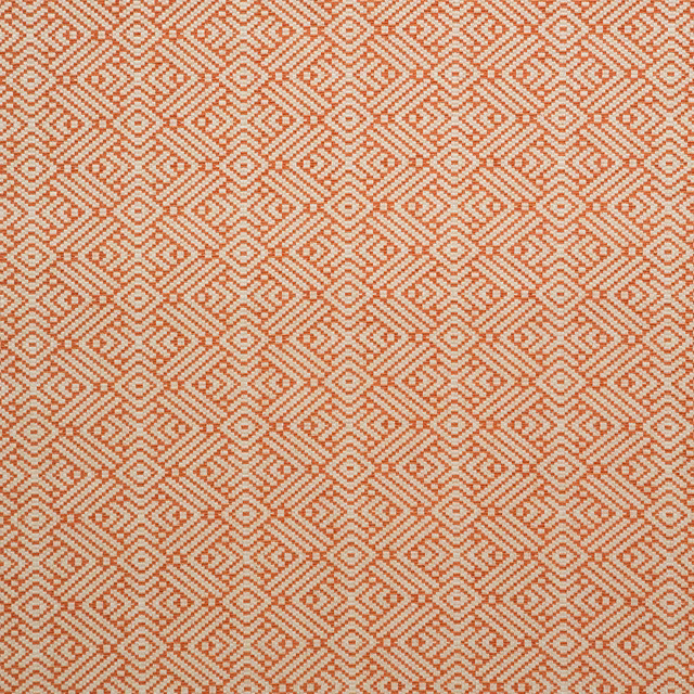Muted terracotta and cream woven fabric with small stepped diamond motifs