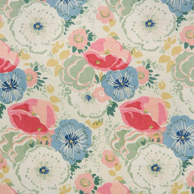 Floral fabric with raspberry pink, blue and green blooms on a cream ground