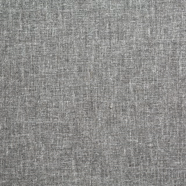 Cool granite-grey woven textile with fine charcoal crosshatch and softly flecked texture