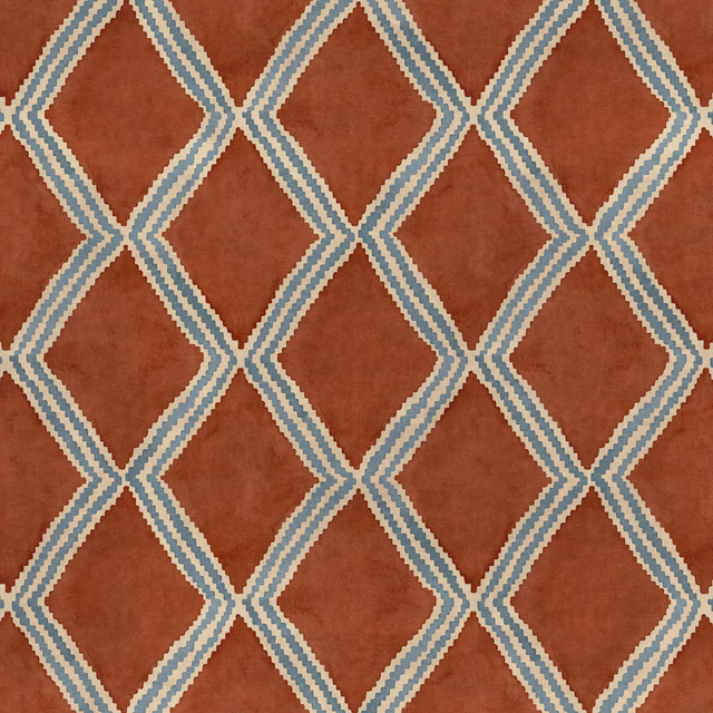 Terracotta geometric fabric with pale blue and cream diamond lattice