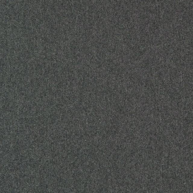 Close-up of deep charcoal wool fabric with a subtle fine mottled weave