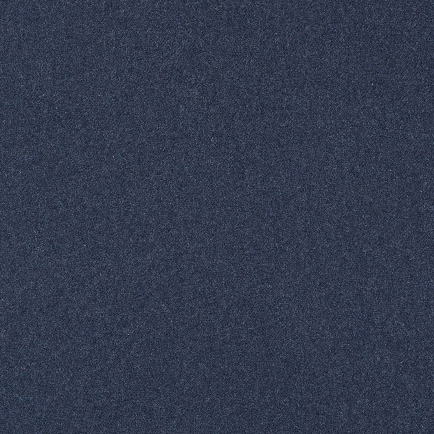 Close-up of deep denim blue plain woven fabric with subtle charcoal mottling