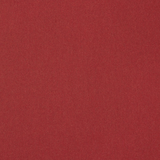 Close-up of deep raspberry red plain wool-blend weave with subtle tonal texture