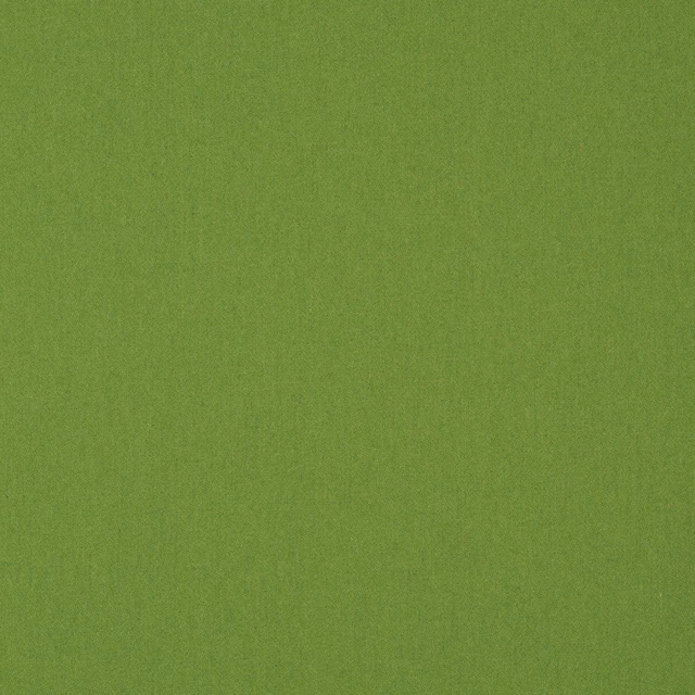 Lime green plain woven fabric with fine vertical texture and softly varied surface