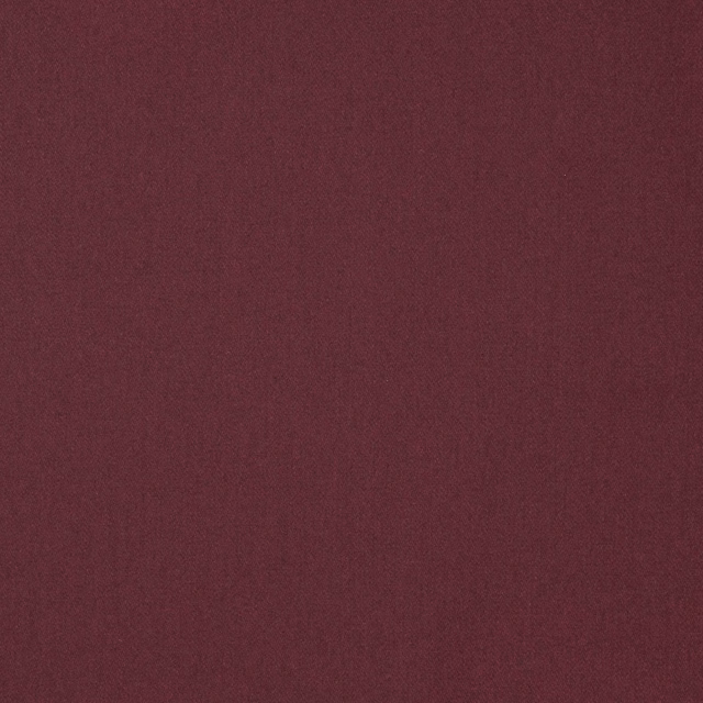 Deep ruby burgundy plain woven wool-blend fabric with subtle tonal texture