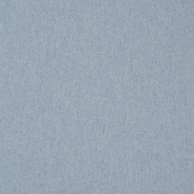 Close-up of pale powder-blue plain weave with softly mottled wool texture