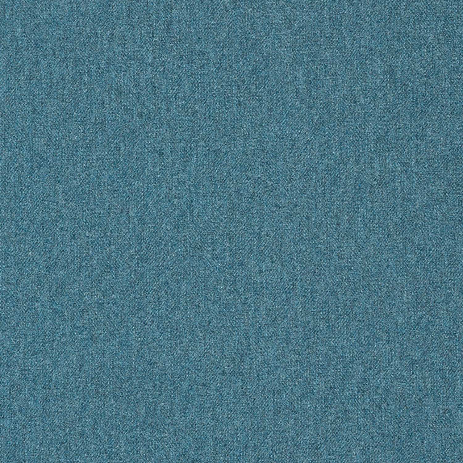 Close-up of softly mottled blue teal plain woven fabric with a fine textured surface