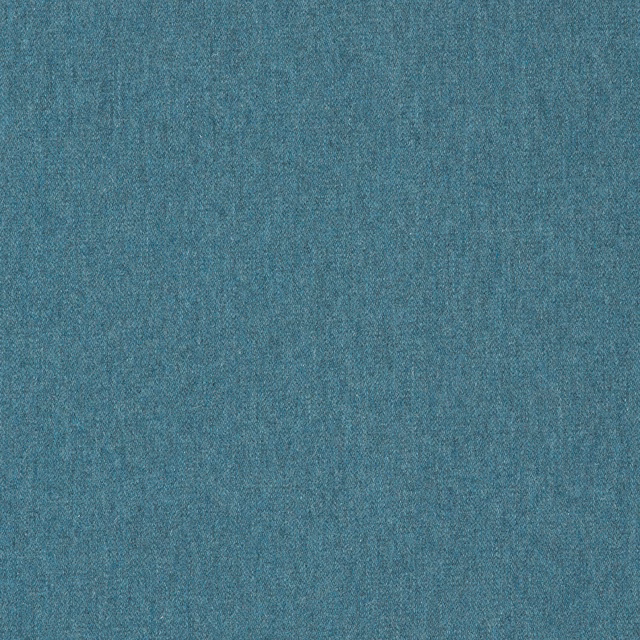 Close-up of softly mottled blue teal plain woven fabric with a fine textured surface