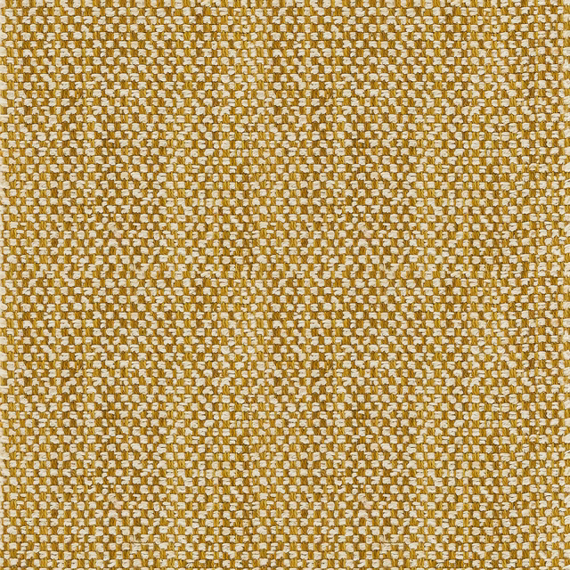 Close-up of warm sand-gold woven upholstery fabric with ivory flecks