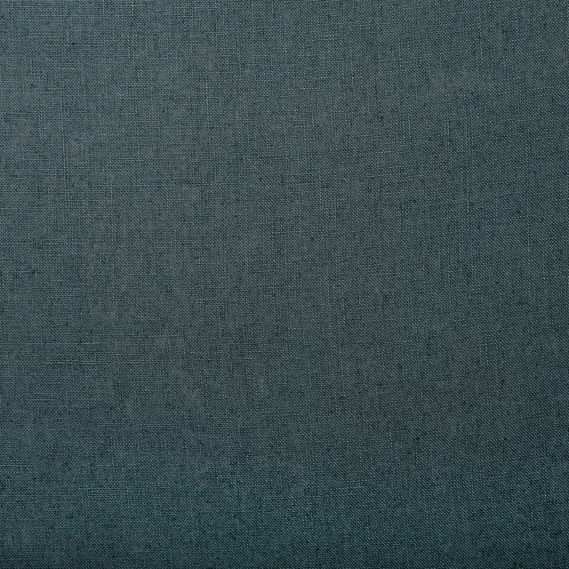 Close-up of deep blue-grey linen with fine plain weave and subtle teal slubs