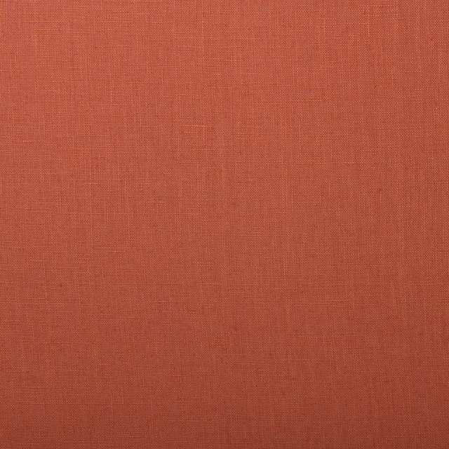 Warm coral linen with a fine plain weave and subtly crosshatched surface