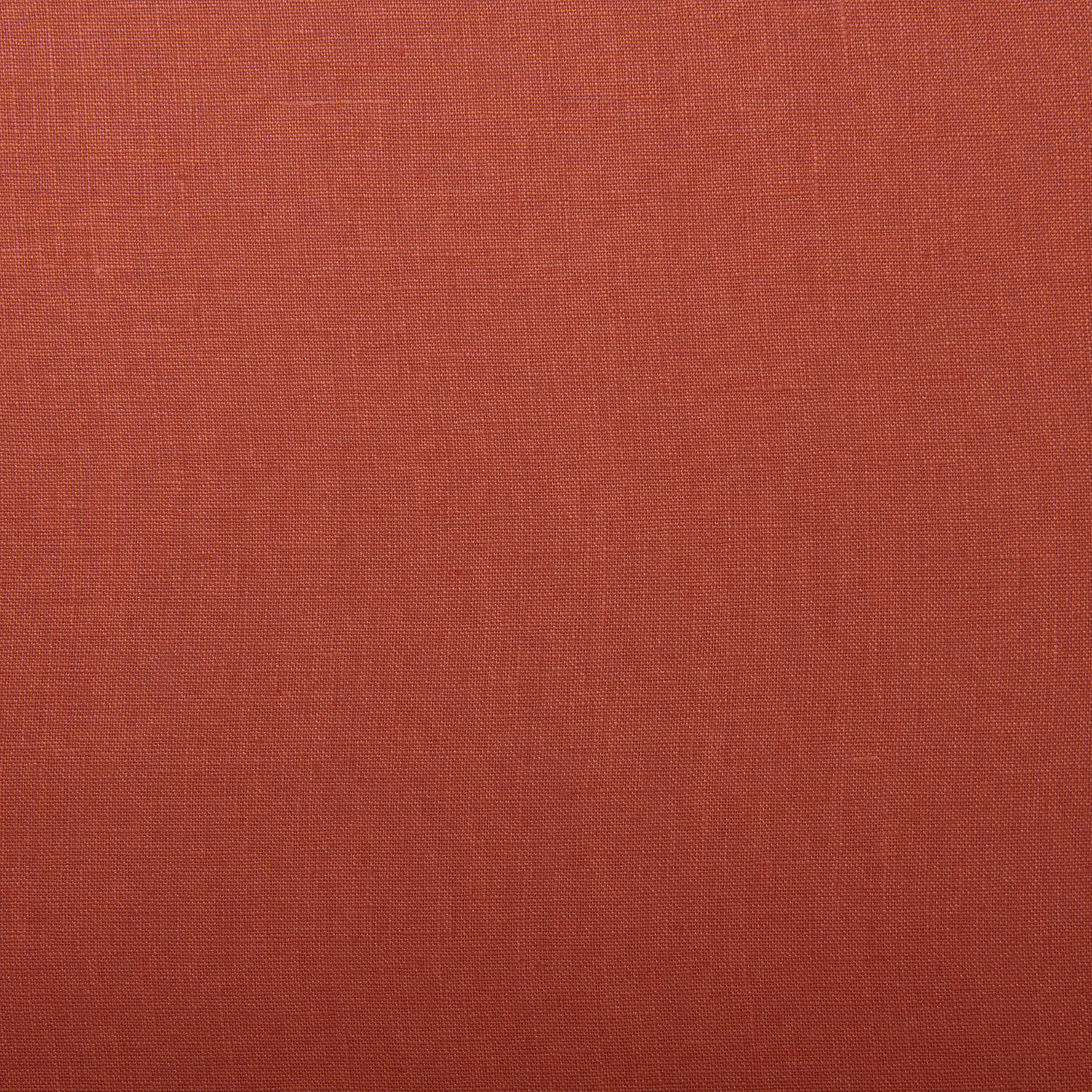 Close-up of muted country red linen showing a fine, even plain weave