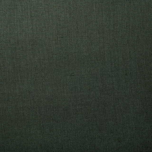 Close-up of deep forest green linen with a fine, irregular crosshatch weave