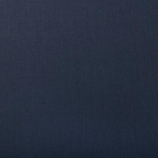 Deep indigo linen swatch showing a fine, even crosshatched plain weave
