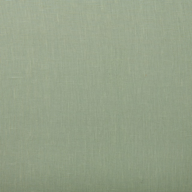 Close-up of pale jade green linen with a fine, subtly slubbed plain weave