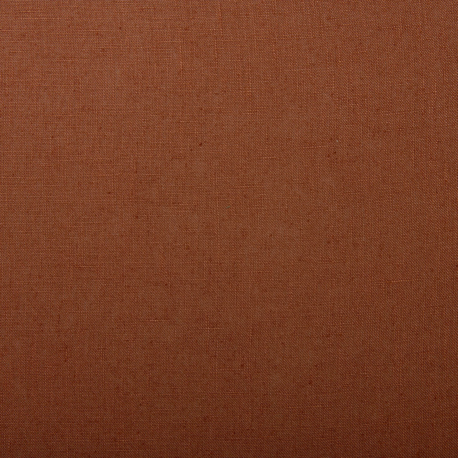 Close-up of warm red-earth linen with a fine, even plain weave