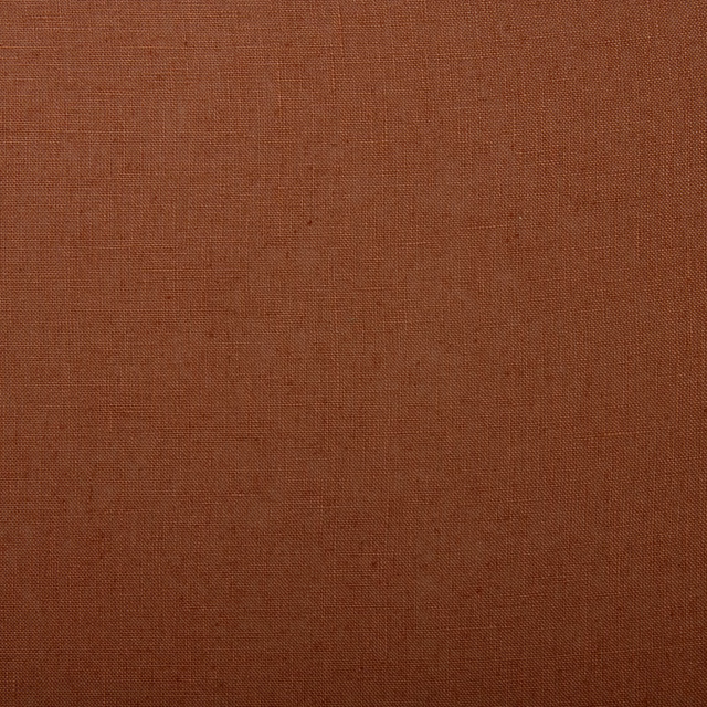 Close-up of warm red-earth linen with a fine, even plain weave