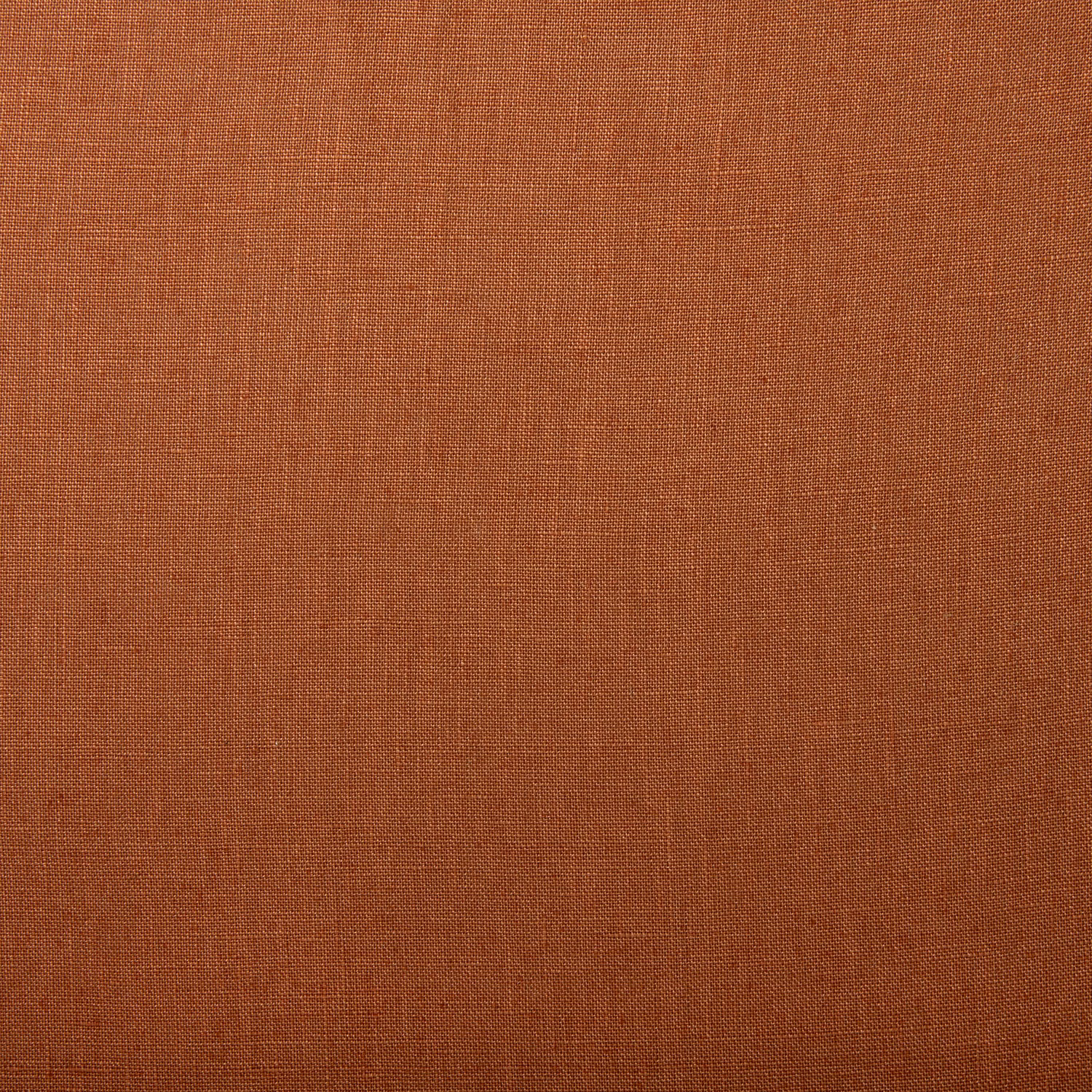 Warm rust-terracotta linen swatch showing a fine, subtly slubbed plain weave