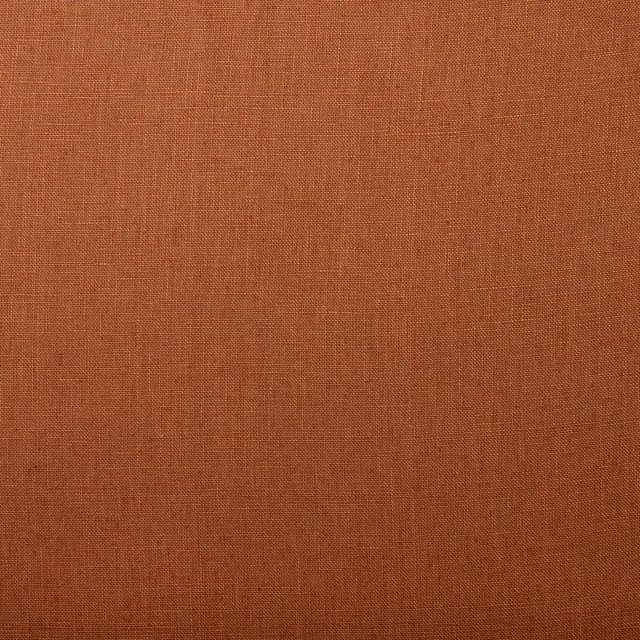 Warm rust-terracotta linen swatch showing a fine, subtly slubbed plain weave