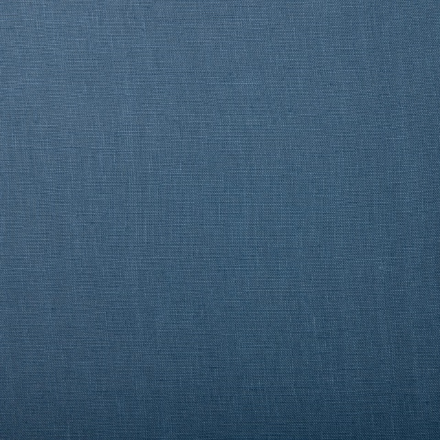 Close-up of plain-woven True Blue linen in a muted denim-blue shade