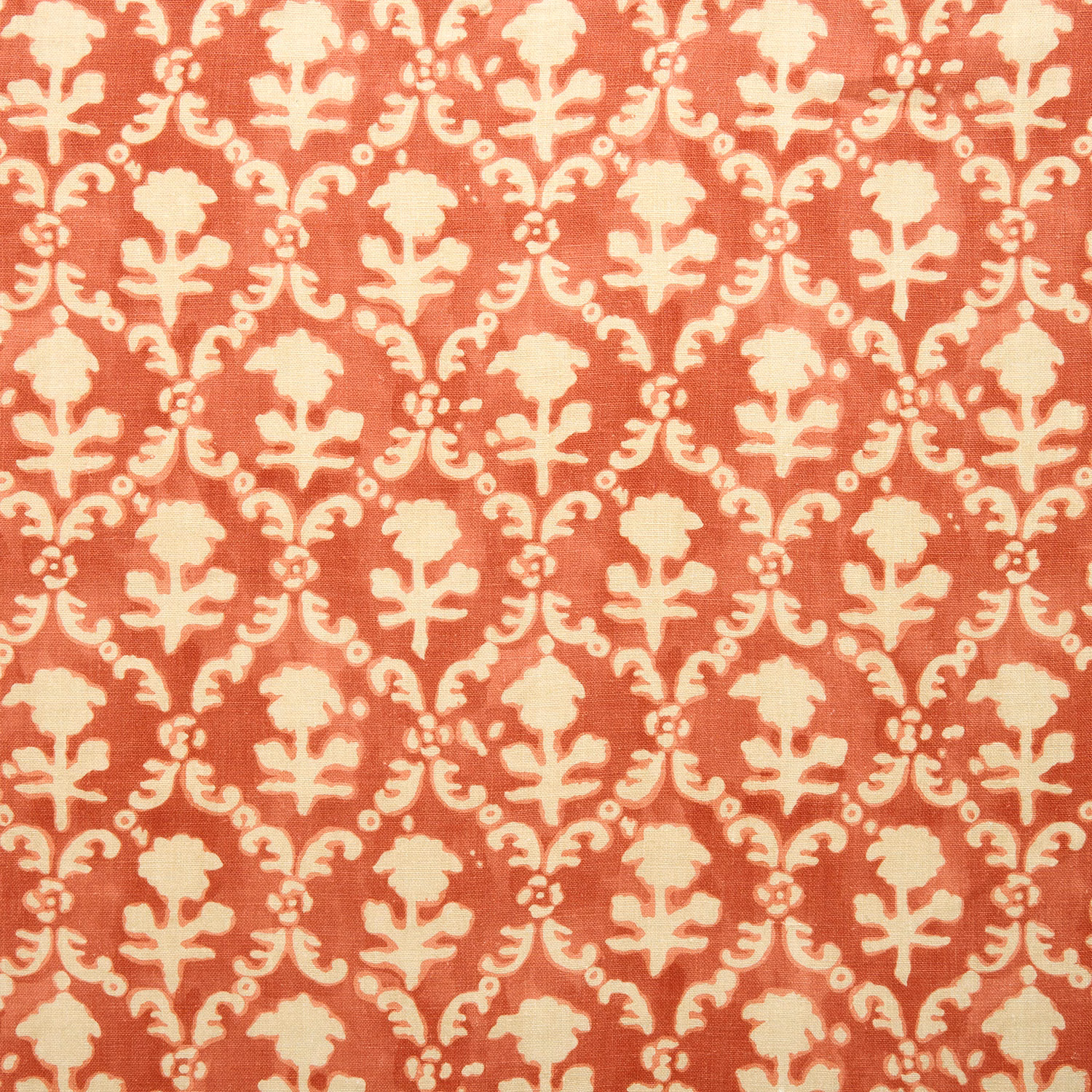 Coral-red linen swatch with cream damask-style repeat pattern