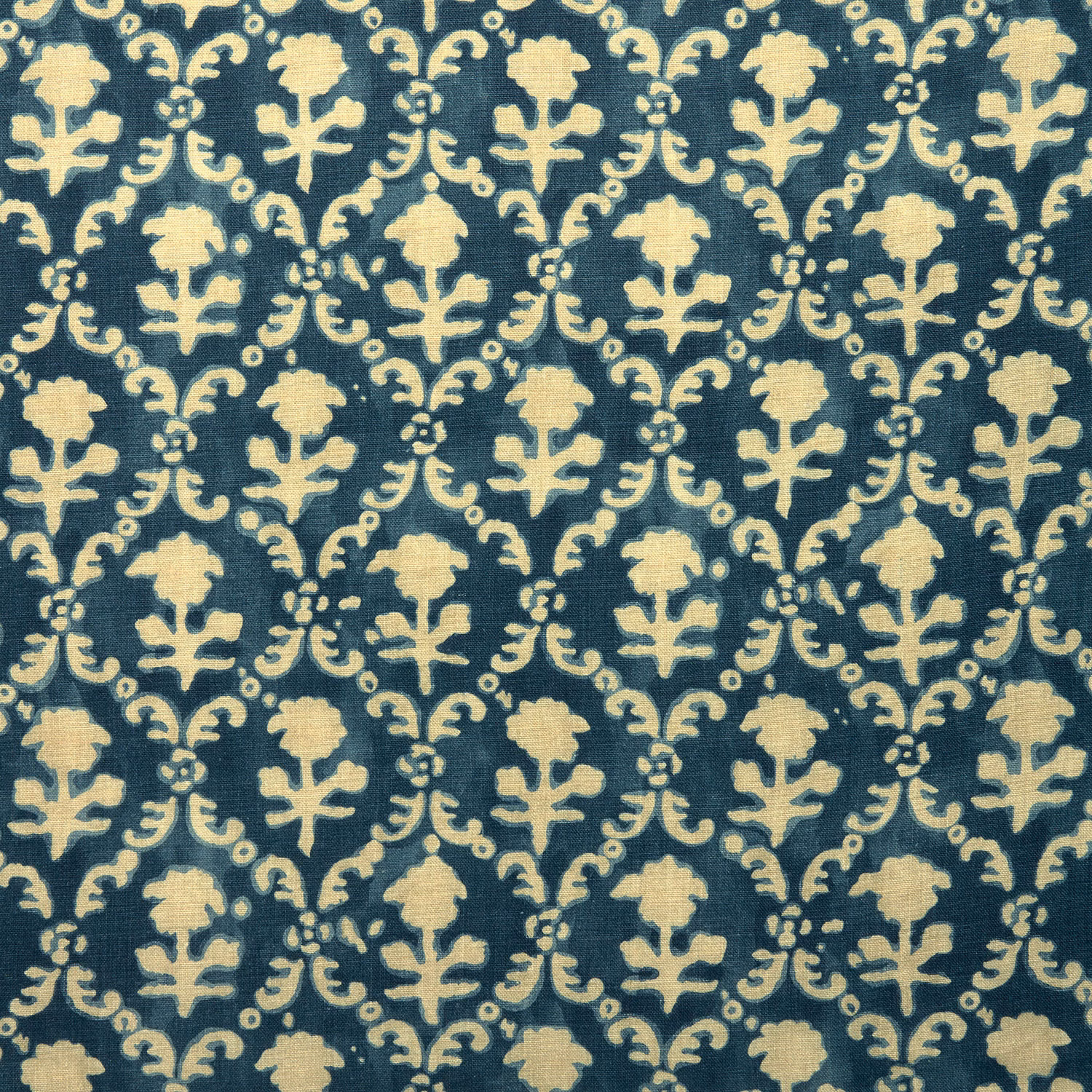 Indigo blue linen fabric with pale cream floral lattice pattern
