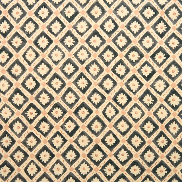 Diamond lattice linen fabric in charcoal black with cream floral motifs and blush accents