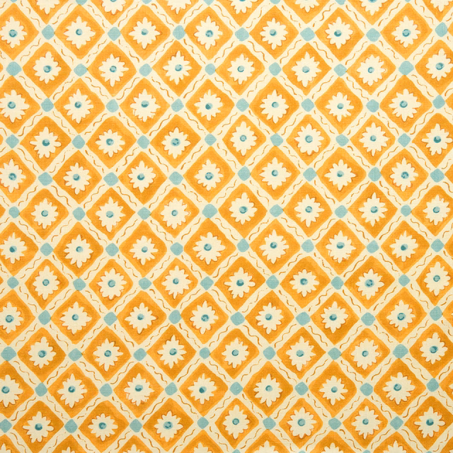 Marigold and cream geometric linen swatch with small aqua floral centres