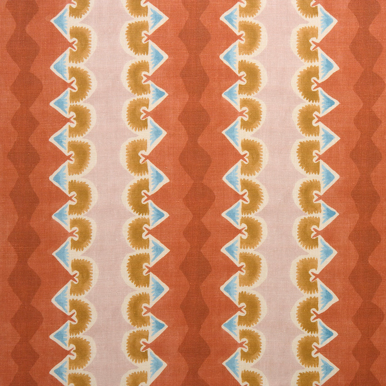 Brick red striped fabric with pale blue and mustard zigzag motifs on a blush ground