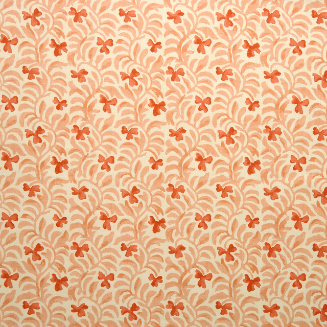 Coral damask cushion fabric with pale scrolling pattern and small floral motifs