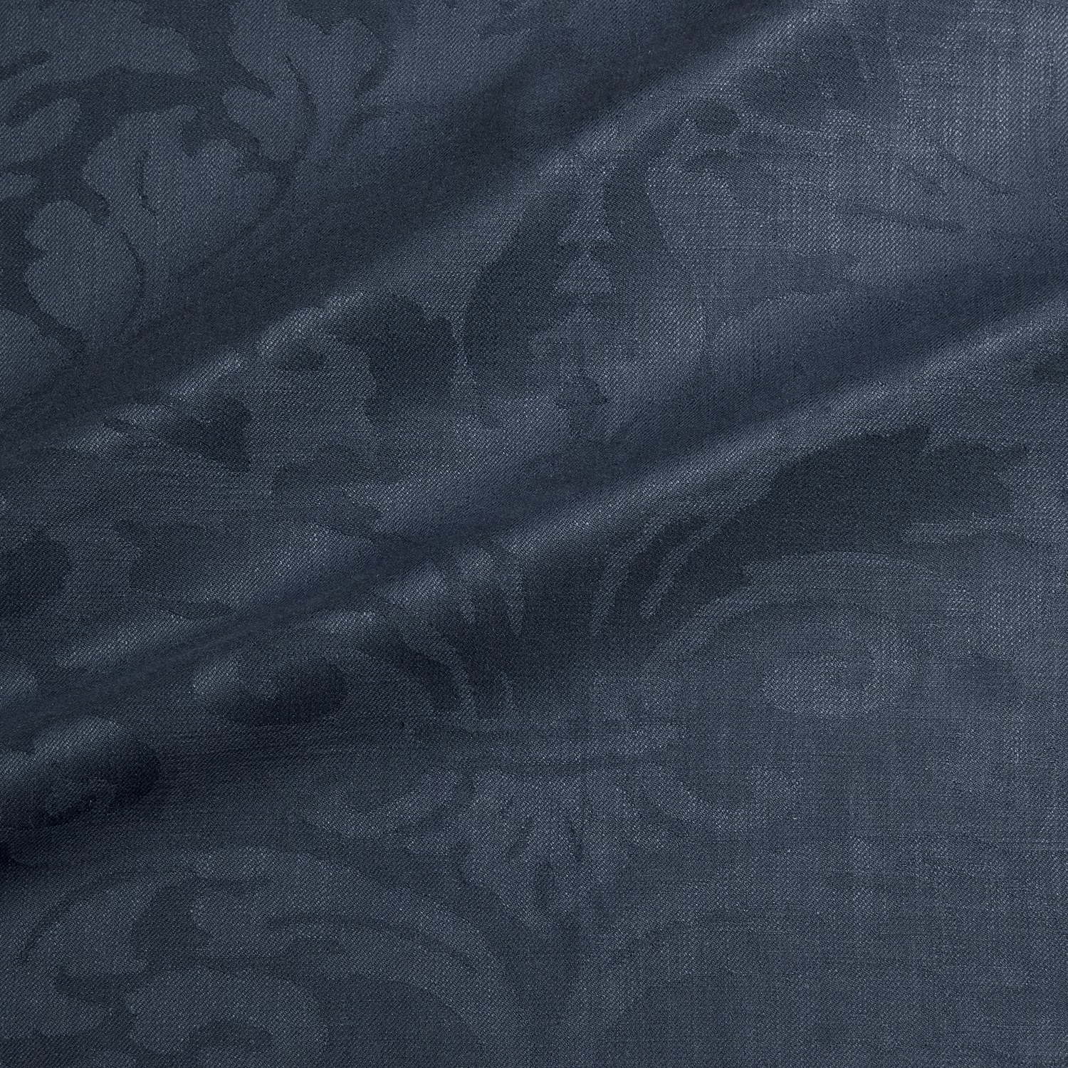 Deep blue-grey damask fabric with large tonal floral scrolls and woven texture