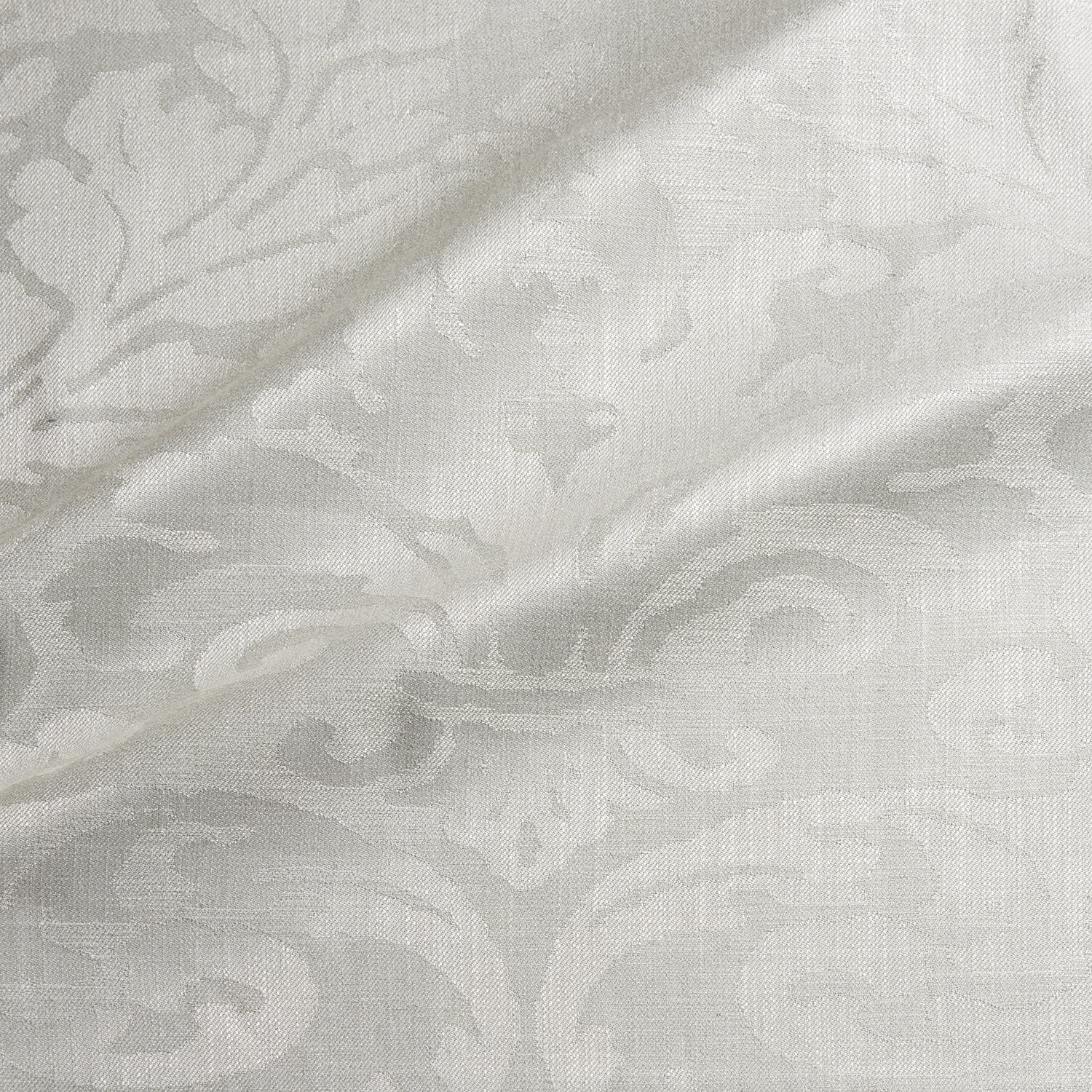 Pale bone damask with ivory-grey scrolls and a softly grained woven surface
