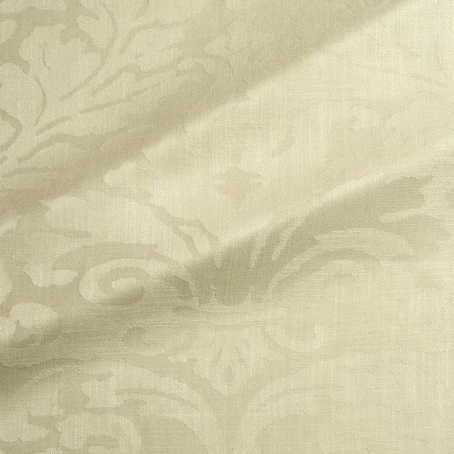 Pale cactus-green woven damask with softly raised tonal scrolling motifs