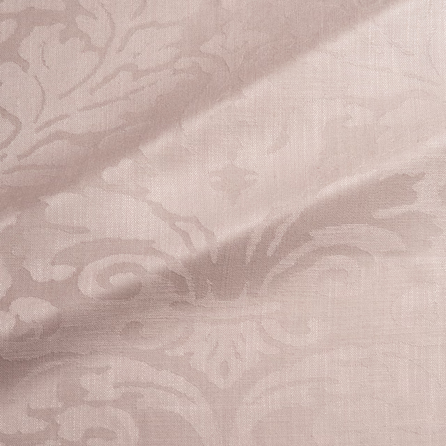 Pale dusky pink woven damask with taupe scrolling motifs and fine crosshatch texture