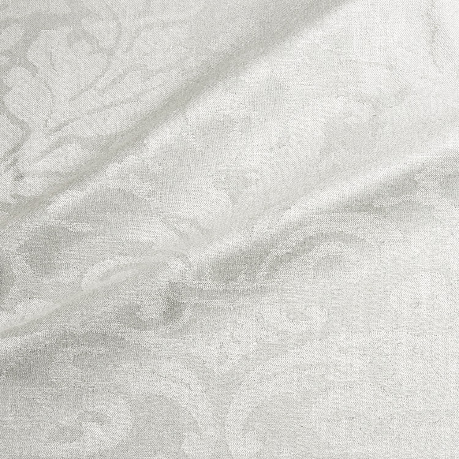 Eggshell damask weave with soft ivory scrolls and subtle raised texture