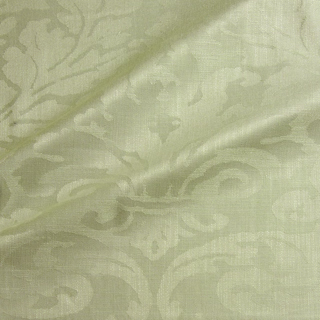 Pale sage green woven damask with scrolling leaves and a soft linen-like texture